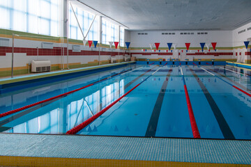 Fototapeta na wymiar Sports pool with blue water