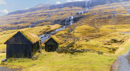 Saksun, Faroe Islands; March 20, 2022 - Saksun is a remote little village on Streymoy island in the Faroe Islands. The village is famous for its unique location and its  many waterfalls.