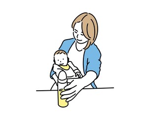 赤ちゃんにミルクをあげようとする母親