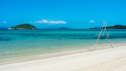 Scenic white sand beach tropical paradise island with crystal clear turquoise sea water and coral reef against blue sky in summer. Koh Mak Island, Trat, Thailand.