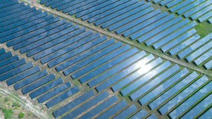 Aerial top view of solar panels or solar cells farm, renewable energy source. Ecotechnology for electric power in the industry.