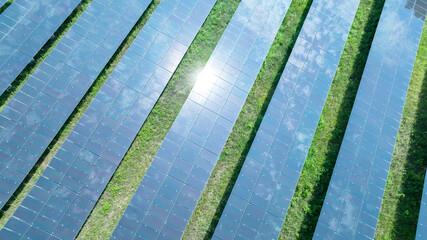 Aerial top view of solar panels or solar cells farm, renewable energy source. Ecotechnology for electric power in the industry.