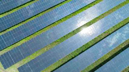 Aerial top view of solar panels or solar cells farm, renewable energy source. Ecotechnology for electric power in the industry.