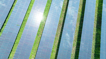 Aerial top view of solar panels or solar cells farm, renewable energy source. Ecotechnology for electric power in the industry.
