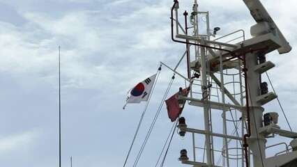View of the flag of South Korea on the mast of the ship. - Powered by Adobe