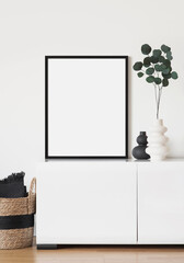 Blank picture frame mockup on gray wall. White living room design. View of modern scandinavian...