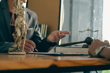 good service cooperation Consulting of businessmen and male lawyers or judges counselors with client-facing teams. Legal service concept with hammer and god of justice on the table