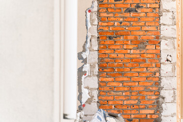 Bricked entrance to the house. Dismantled facade. House redevelopment