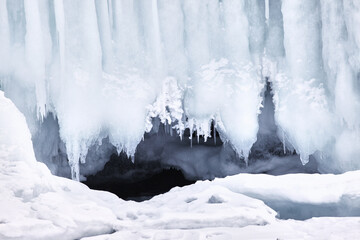 Frozen splash water on Baikal lake. Abstract winter background. Amazing scenery with frozen water