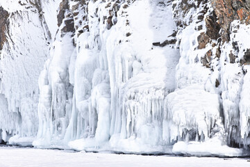 Frozen splash water on Baikal lake. Abstract winter background. Amazing scenery with frozen water