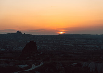 Sunset at Cappadocia. Sunset view Cappadocia. Travel to Turkey background photo.