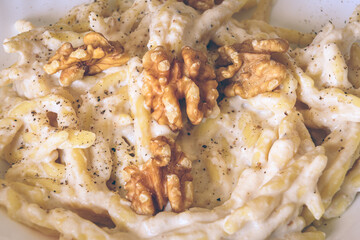 Italian Trofie Pasta With Ricotta Cheese, Walnuts And Black Pepper