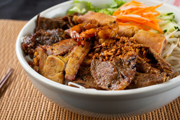 A closeup view of a bowl of Vietnamese vermicelli noodles known as Bún.