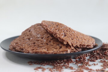 Red rice pancakes. Pancakes made of a fermented batter of red rice and coconut.