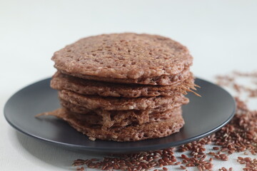 Red rice pancakes. Pancakes made of a fermented batter of red rice and coconut.