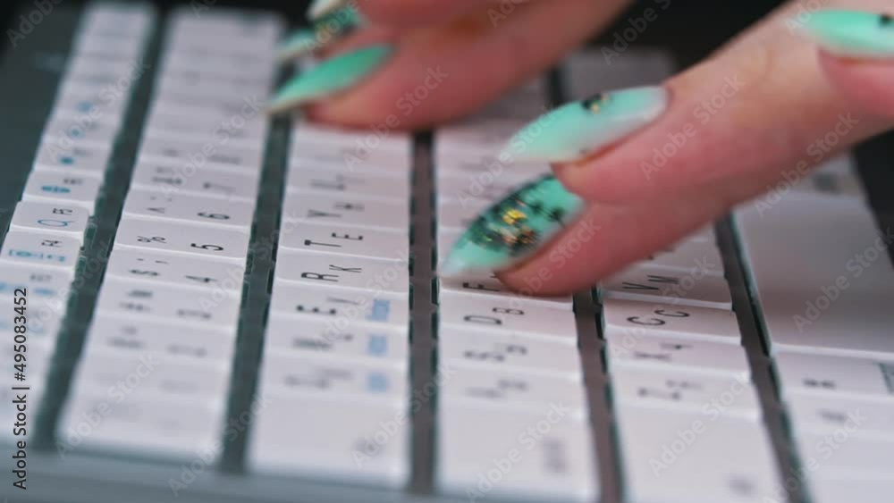 Poster business woman's fingers are typing on the keyboard of a white laptop. the hands of a young girl are