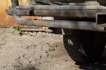 Old rusty bumper of a vehicle