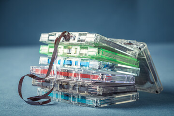 Pile of transparent cassette tapes and extracted tape