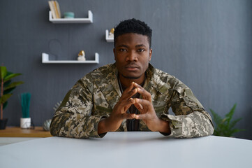 Sad military man looking at camera portrait