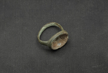 Antique finger ring on black background