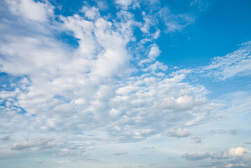 Smooth white clouds on clear blue sky background and copy space. Outdoor nature or save the earth concept.	