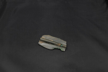 antique spear head on black background