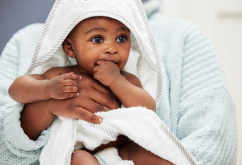 A nap is exactly what I need after that bath. Shot of an adorable baby boy wrapped in a bath towel.