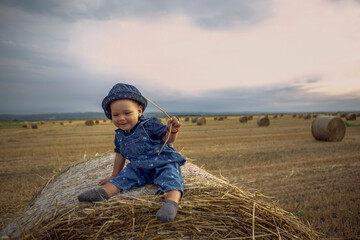 Naklejka na ściany i meble Family outdoor lifestyle. Freedom concept. Smiling little girl in summer field