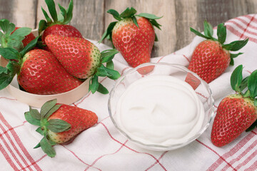 Fresh ripe summer organic strawberries, rustic wooden background