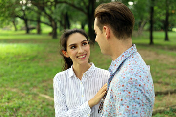 Obraz premium Happiness young couple relaxation and resting at public park.