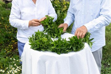 Farmers knit bouquets of greenery and mint