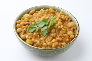 Indian Food-Ragda Pattice is popular street food of India. Ragada is a curry made of yellow vatana & pattice is made of potatoes along with spices. garnished with Sweet & mint chutney, chopped onions.