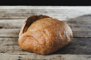 Whole bread on wooden table