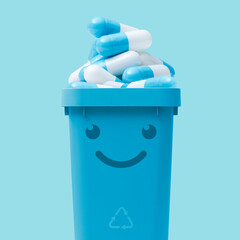 Smiling trash can full of pills