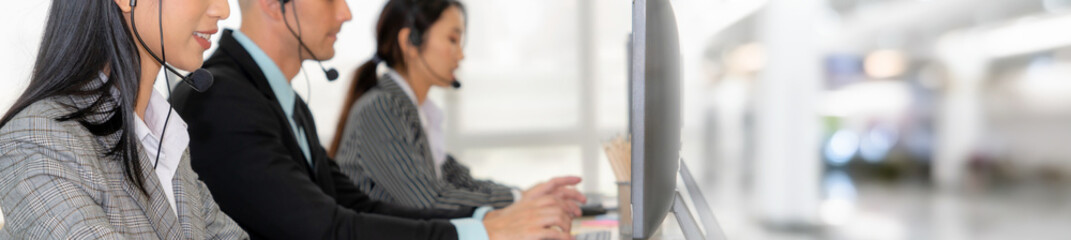 Call center or customer support agent in broaden view panoramic banner wearing headset while...