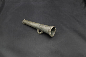 antique spear head on black background