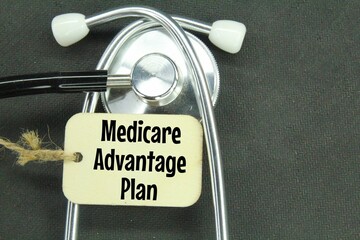 stethoscope and wooden tag with the words medicare advantage plan
