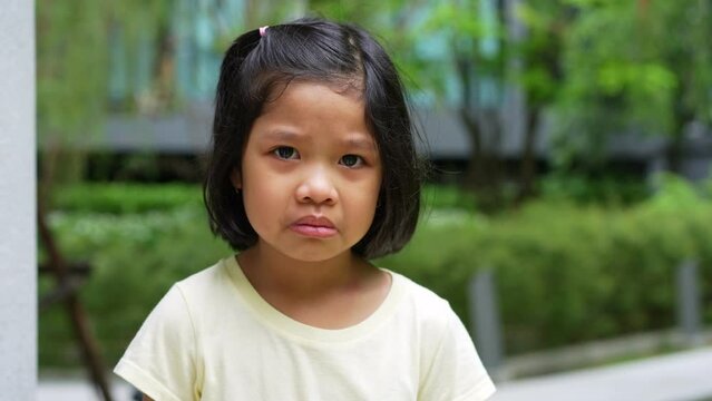 Portrait of Asian angry, sad and cry little girl, The emotion of a child when tantrum and mad, expression grumpy emotion. Kid emotional control concept