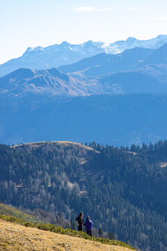 Beautiful landscape in the mountains with peaks against the blue sky and valleys covered with grass