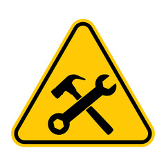 Under construction sign. Vector illustration of yellow triangle warning sign with crossed hammer and wrench icon inside. Construction site caution symbol. Risk of accident.