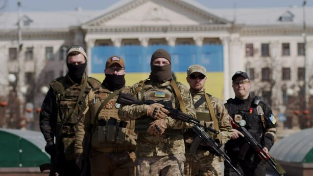 The military approached her and covered her with themselves, protecting her from the war.
