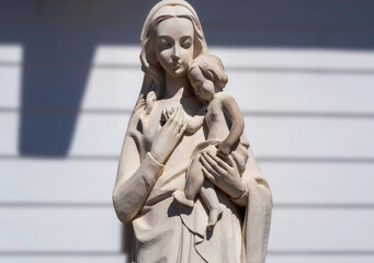 Wood carving of The baby Jesus and Mary