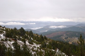 landscape of hills in winter under snow