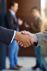 Business agreements. Shot of two businesspeople shaking hands.