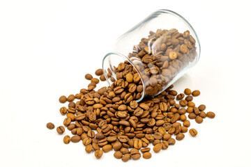 Glass jar with coffee beans on white background. Close up of coffee.