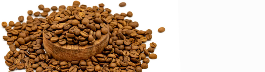 Coffee beans in wooden plate on dark background. close up. Copy space. Space for text