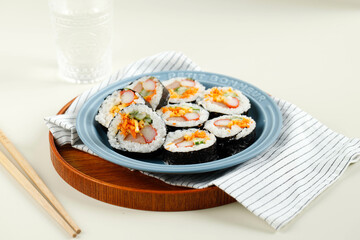 Korean Roll Gimbap (Kimbob or Kimbap) made from Steamed White Rice (Bap) and Various other Ingredients, Such As Kyuri, Carrot, Sausage, Crab Stick, or Kimchi