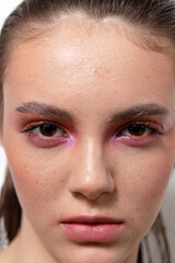 Large beauty portrait of a beautiful girl with bright makeup
