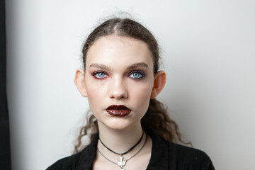 Portrait of a girl with a beautiful and unusual appearance with makeup