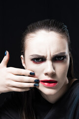 Creative Beauty Portrait with Red Lips and Blue Eyes on a Black Background 